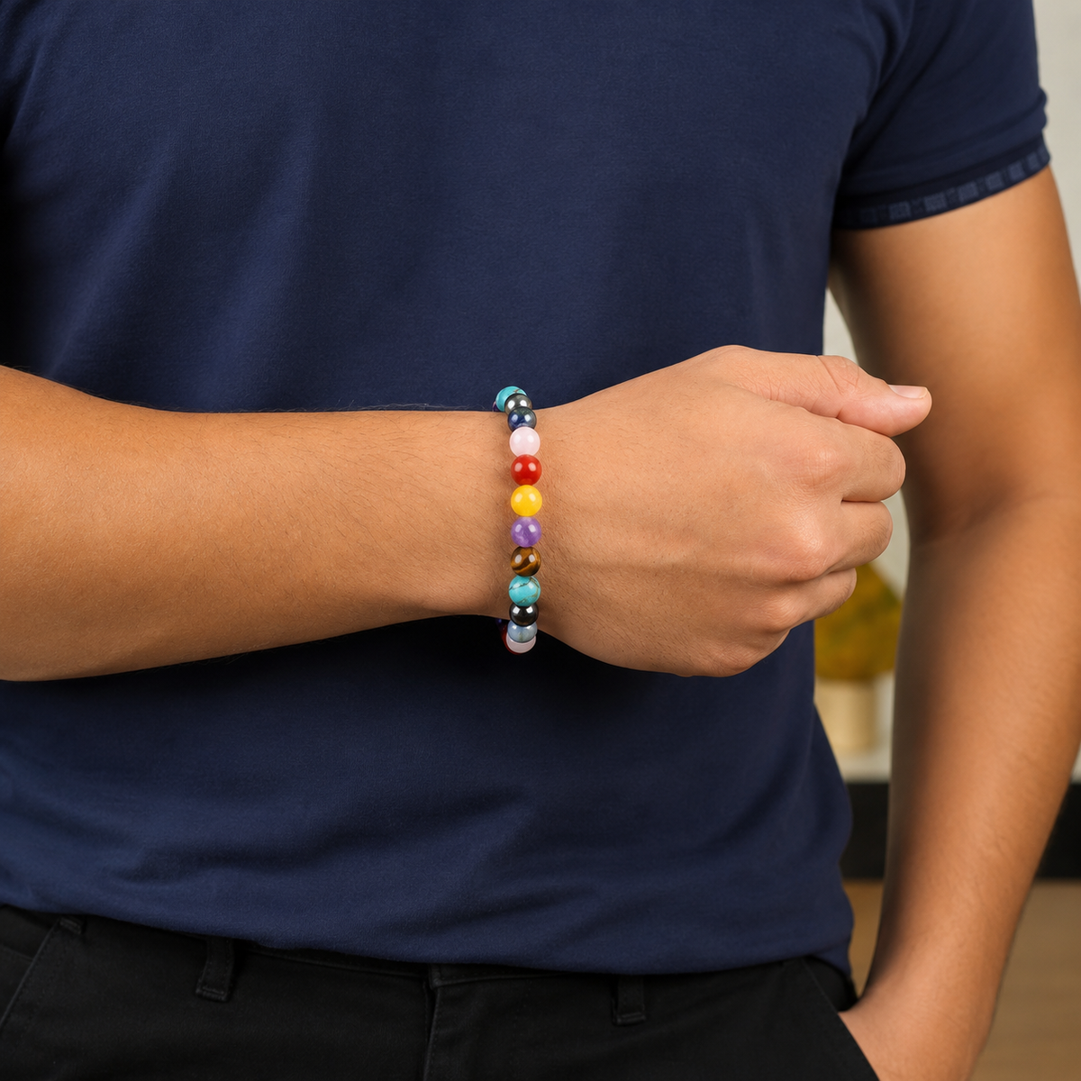 Man wearing the 7 Chakra natural crystal stone bracelet on wrist for daily spiritual wellness