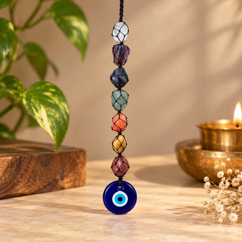7 Chakra Evil Eye Hanging with seven colorful chakra stones and blue evil eye pendant by DivyaZone