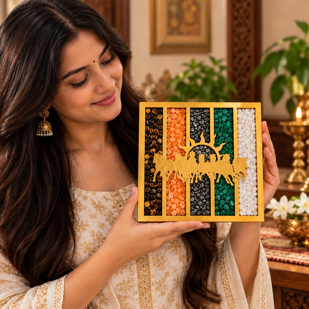 Indian woman holding a square gold finish seven horses crystal frame with five colourful gemstone panels
