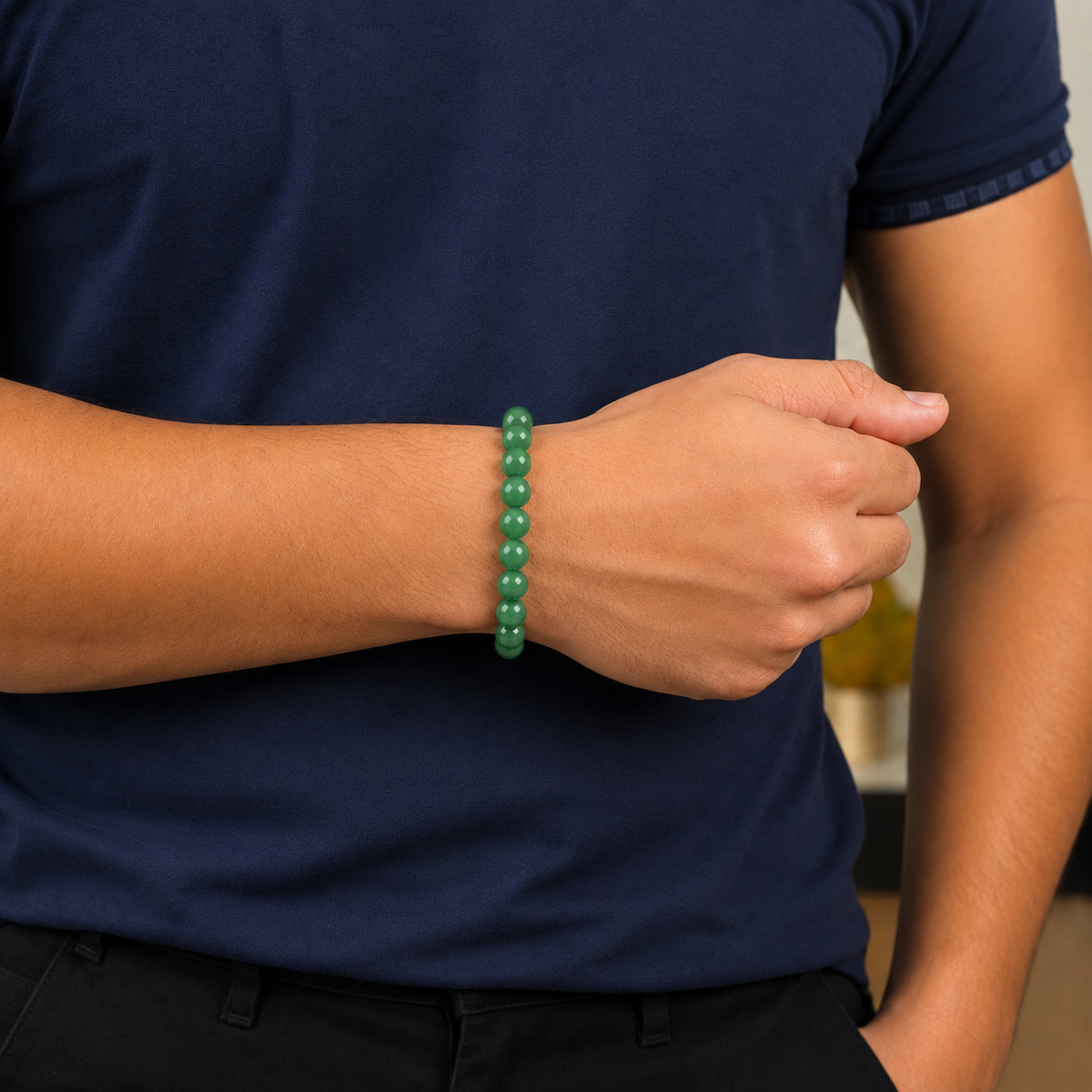 Man wearing a natural Green Aventurine crystal bracelet by DIVYAZONE