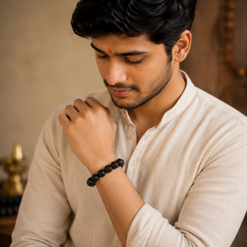 Man wearing natural Karungali ebony wood bracelet for everyday spiritual wear