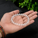 Natural Clear Quartz crystal bracelet held in hand