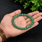 Natural Green Aventurine crystal bracelet held in hand