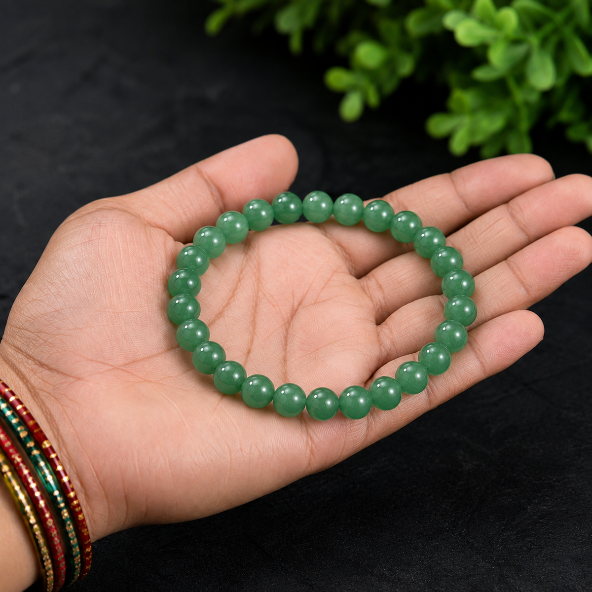 Natural Green Aventurine crystal bracelet held in hand