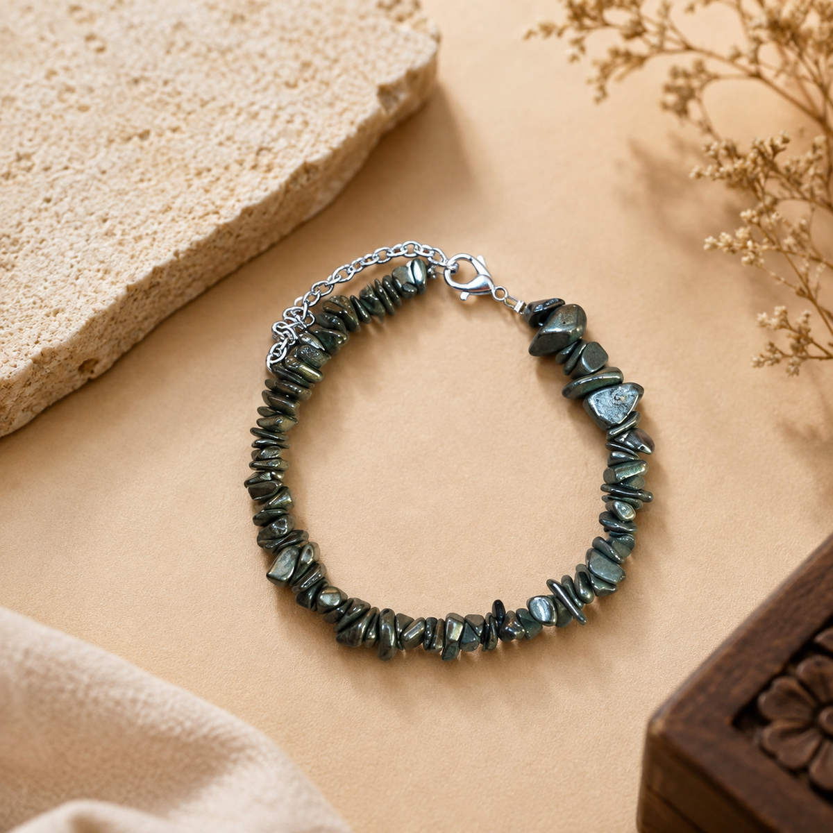 Natural Pyrite Stone Splash Bracelet with irregular raw pyrite chips and adjustable silver chain displayed on a premium beige background
