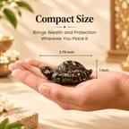 Pyrite Tortoise held in a hand showing its compact 2.75 inch length and 1 inch height