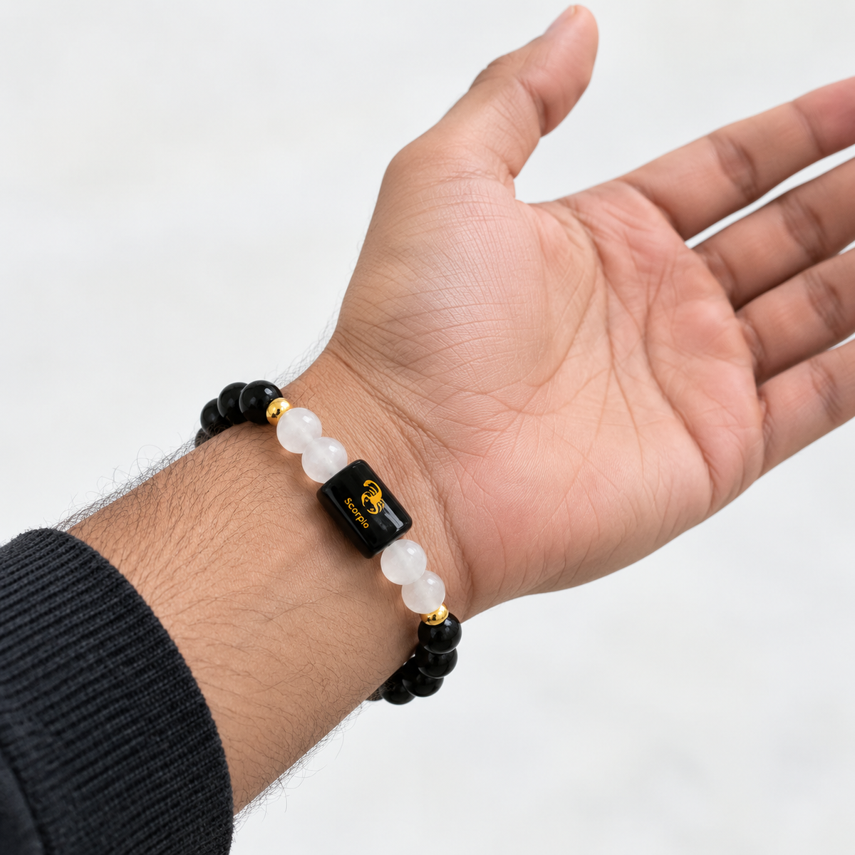 Scorpio Black Obsidian and Milky Quartz bracelet worn on hand with 8mm crystal beads